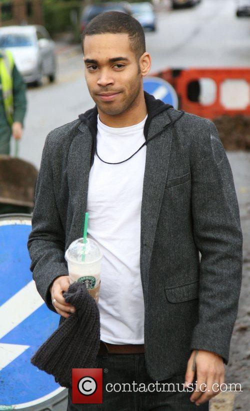 Danyl Johnson outside the 'X Factor' house carrying a Starbucks 6