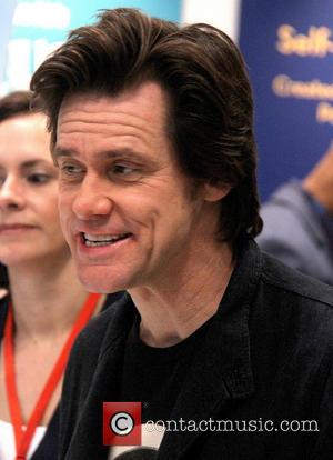 Jim Carrey Shows Off His Chipped Tooth To Promote 'Dumb And Dumber' Sequel  | Contactmusic.com